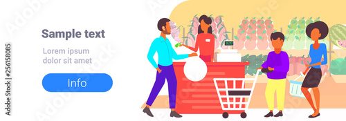 people customers with trolley carts standing line queue to cashier in retail store supermarket big grocery shopping center horizontal banner copy space flat full length