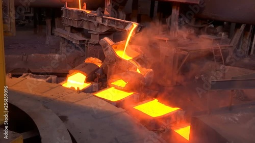 Pouring Molten Copper Into Molds In A Foundry / Processing of copper ore in the foundry,liquid metal is poured into molds