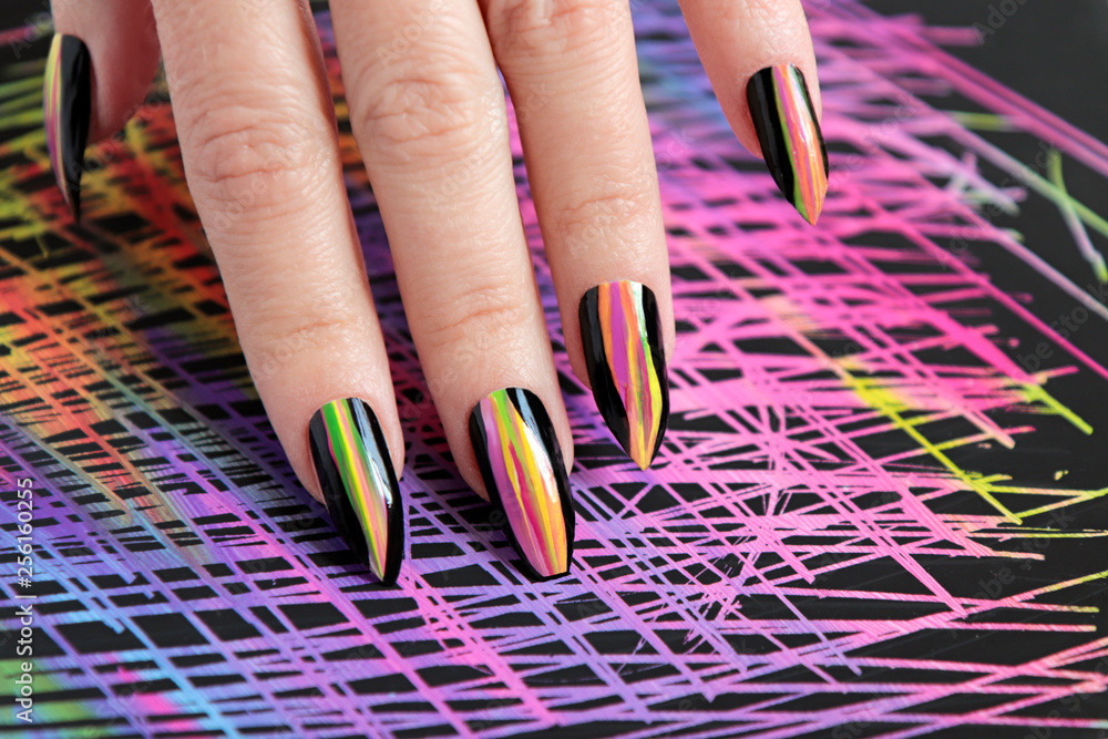 Colorful bright manicure with different sharp shape of nails framed with  black lacquer.Nail art. Creative nail design on color background.  Stock-Foto | Adobe Stock