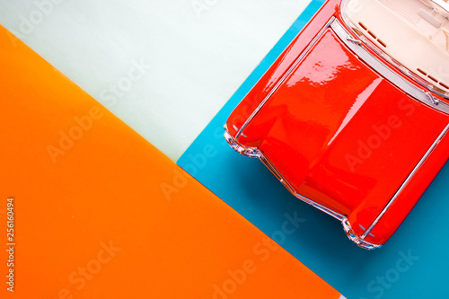 Beautiful colorful background whith part of Red retro classic car. Hood of antique retro car.