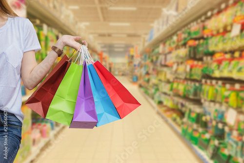 Young woman with shopping bags walking and shopping in supermarkets, Woman lifestyle concept 