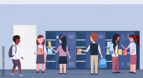 mix race schoolchildren group taking books out of lockers modern school corridor interior education concept horizontal banner full length flat