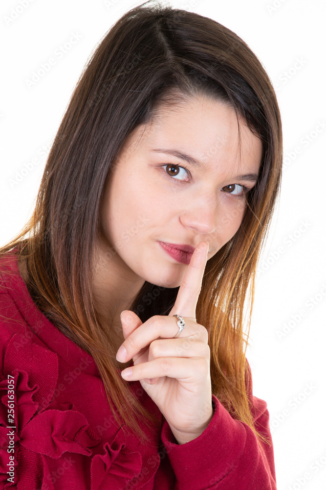 beautiful young woman with long hair shows hush sign has serious expression asks not to tell her secret anybody shh hopes for loyality and silence beautiful young woman with long hair shows hush sign has serious expression asks not to tell her secret anybody shh hopes for loyality and silence