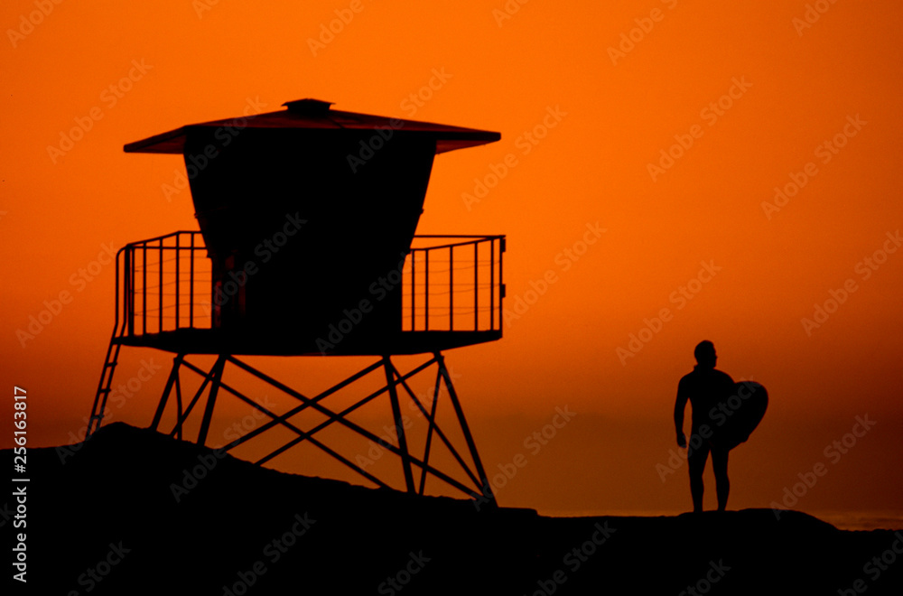 Naklejka premium Surfer and Lifeguard tower