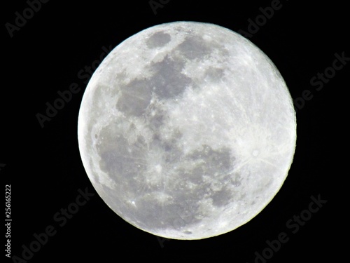 Beautiful bright Full Moon in the night sky. This is also called Super Moon photo
