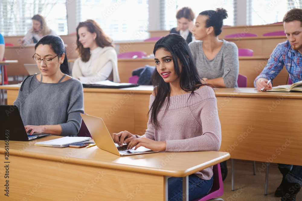 Multinational group of students in an auditorium Multinational group of students in an auditorium