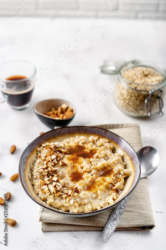 Healthy homemade oatmeal with nuts for breakfast