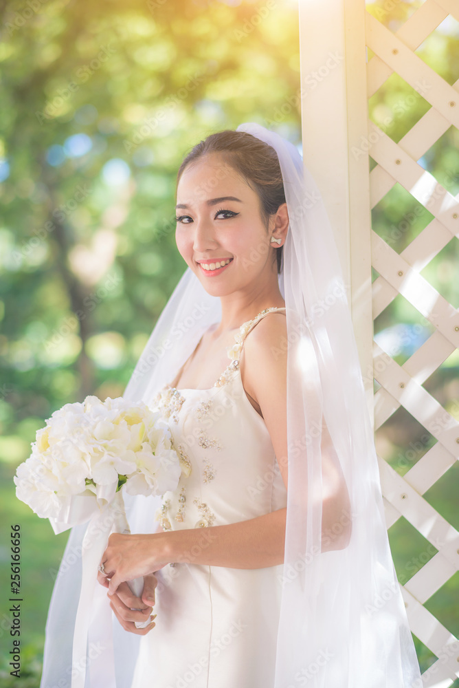 Wedding concept. Beautiful bride with bouquet 
