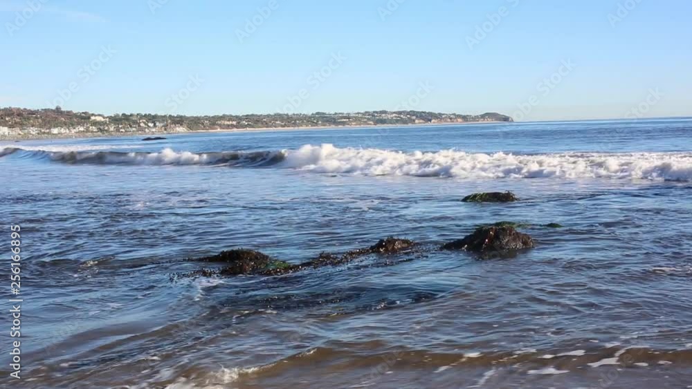 the water as it rolls into the shore the water as it rolls into the shore