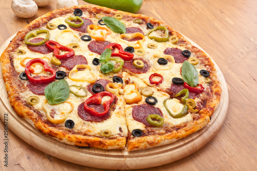 pepperoni and vegetable  pizza with ingredients
