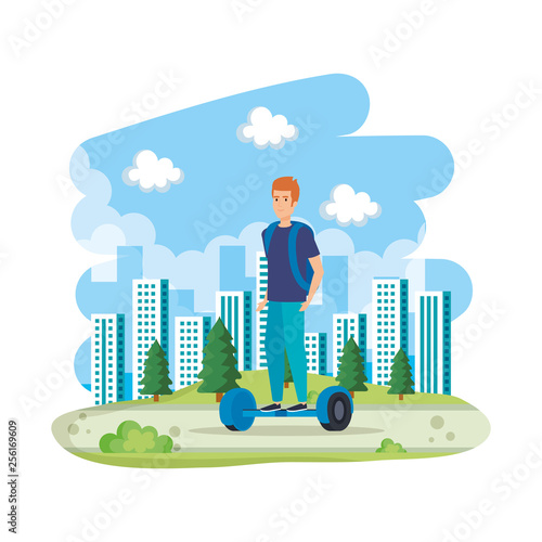 young man in hoverboard electric in the landscape
