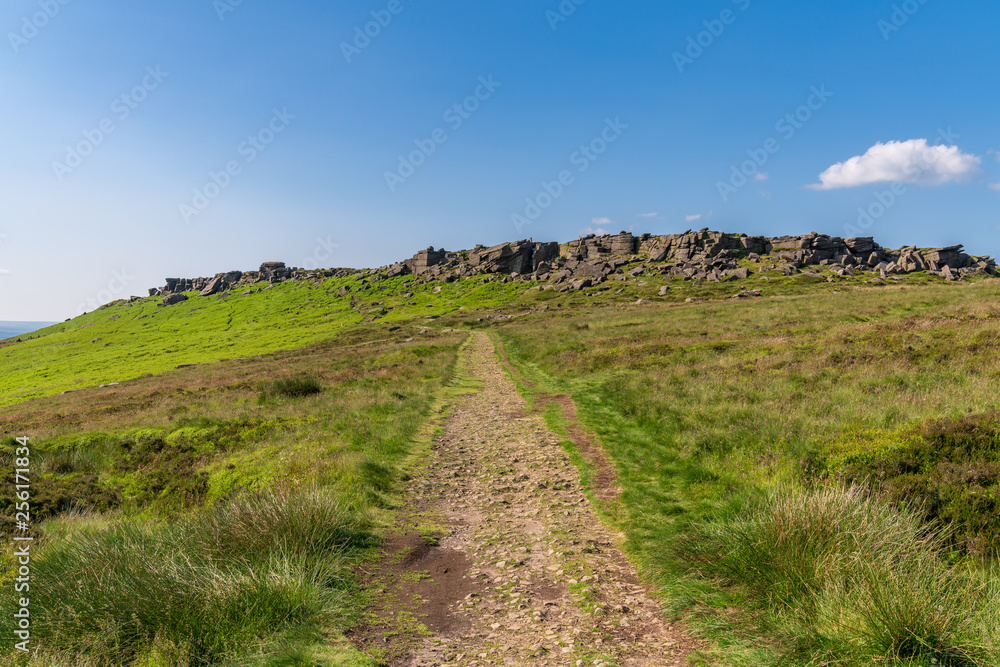 Peak District landscape, walking towards Stanage Edge near Hathersage in the East Midlands, Derbyshire, England, UK Peak District landscape, walking towards Stanage Edge near Hathersage in the East Midlands, Derbyshire, England, UK