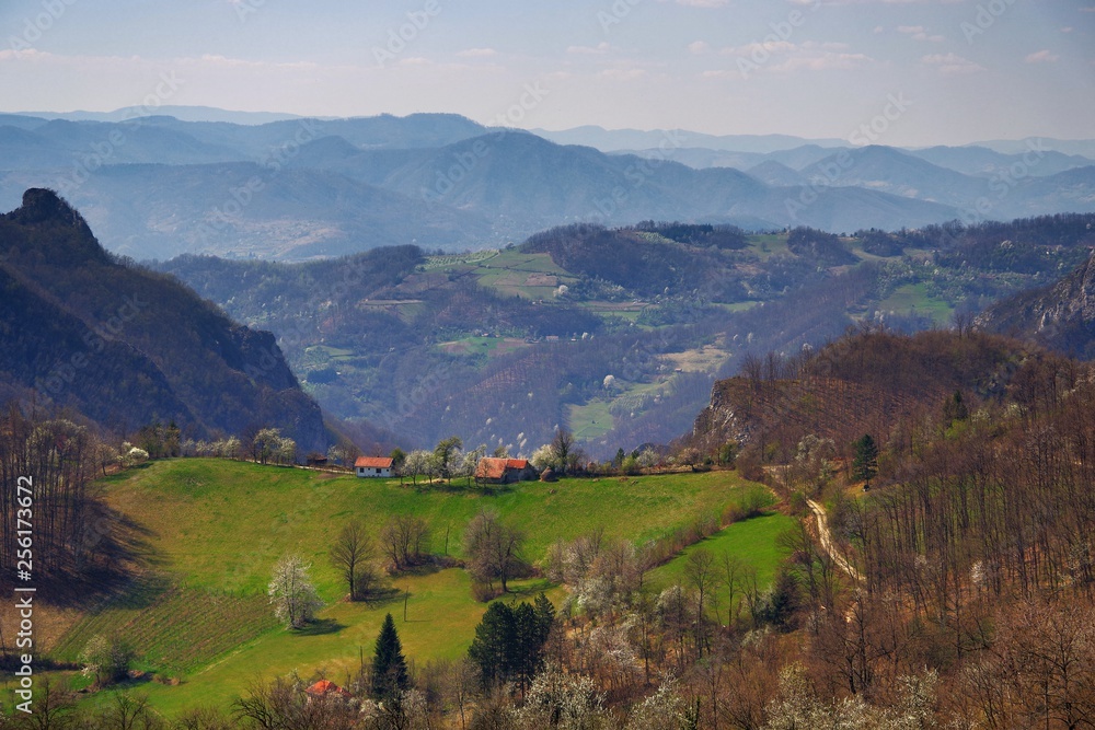 Obraz premium Stunning mountain scenery in spring in Europe with many green hills and trees