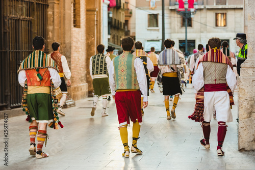 Valencia, Spain - March 17, 2019: Men Falleros dressed in the traditional Valencian costume during the party of Fallas in spring. photo
