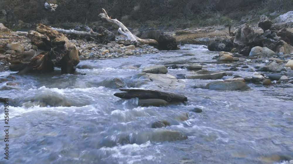 Views of a rapidly flowing river near a cliff. Rugged trees and river rocks. Slow and relaxed. Calming. Wine Country's hidden beauty. NorCal, Northern California Views of a rapidly flowing river near a cliff. Rugged trees and river rocks. Slow and relaxed. Calming. Wine Country's hidden beauty. NorCal, Northern California