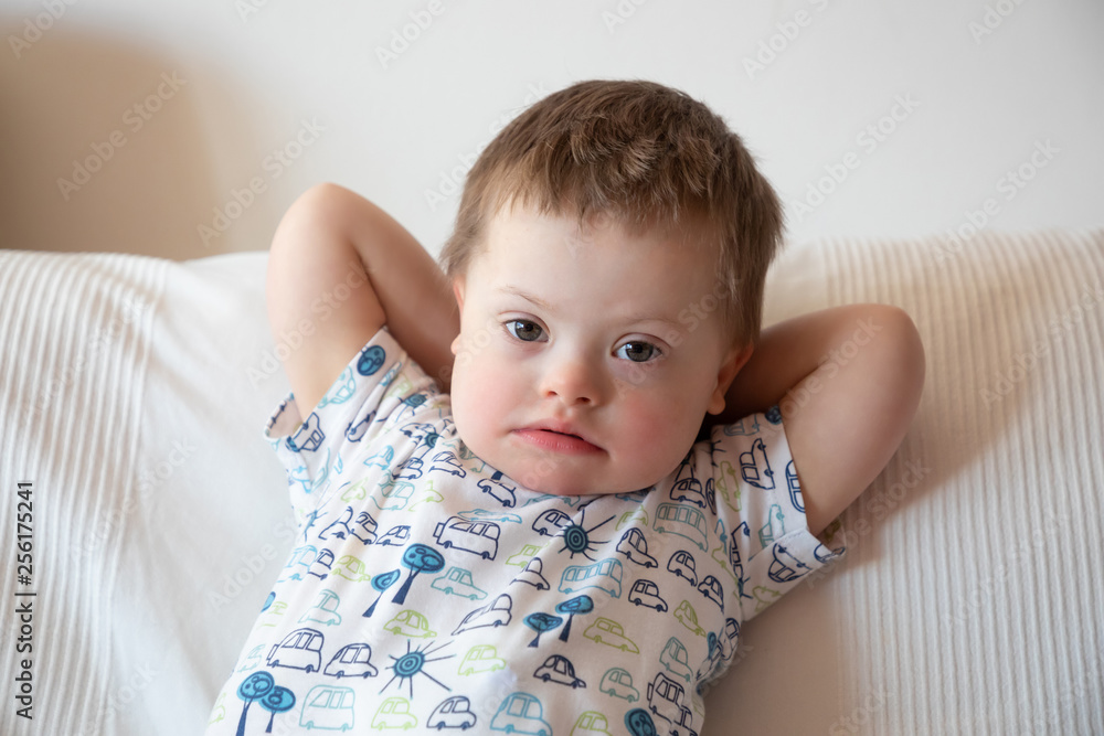 Portrait of cute small boy with Down syndrome Portrait of cute small boy with Down syndrome