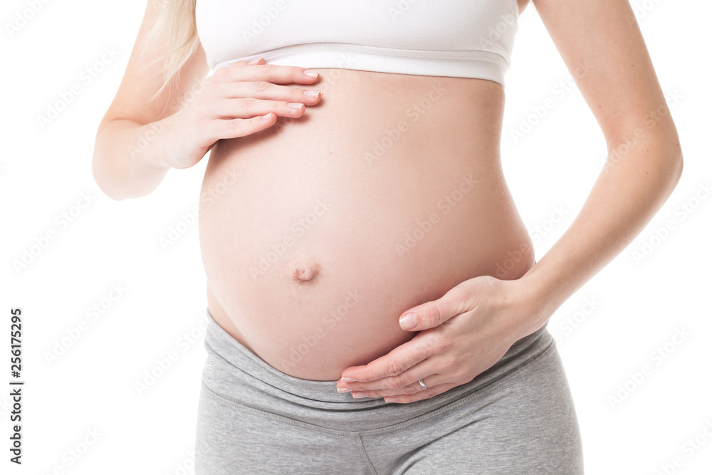 Close-up of pregnant woman touching her belly Close-up of pregnant woman touching her belly