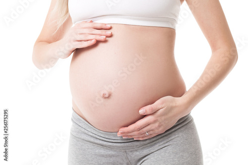 Close-up of pregnant woman touching her belly © Aleksandr Doodko