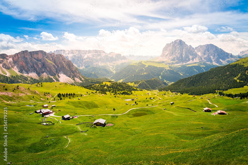 beautiful view of a green valley and dolomites mountains during summer in val gardena, saslong, south tyrol