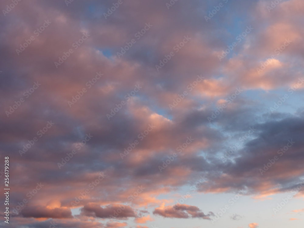 colorful blue sky with clouds at sunset.