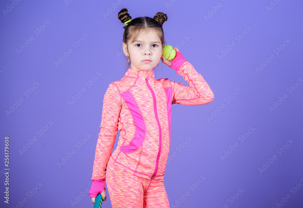 Girl cute child double bun hairstyle tennis player. Active games. Sport upbringing. Small cutie likes tennis. Sport equipment store. Play tennis for fun. Little baby sporty costume play tennis game Girl cute child double bun hairstyle tennis player. Active games. Sport upbringing. Small cutie likes tennis. Sport equipment store. Play tennis for fun. Little baby sporty costume play tennis game