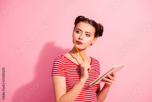 Close-up portrait of her she nice-looking cute attractive winsome lovely focused concentrated girl wearing striped t-shirt creating notes copybook isolated over pink pastel background