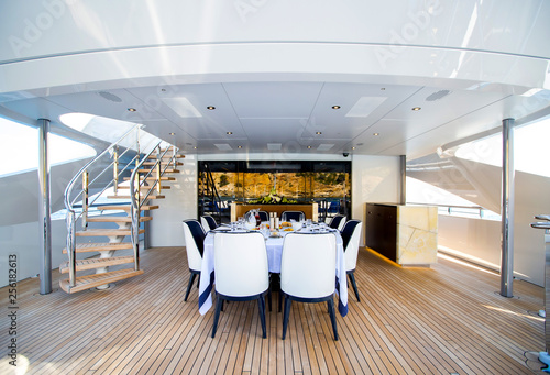Luxury big yacht deck with served table