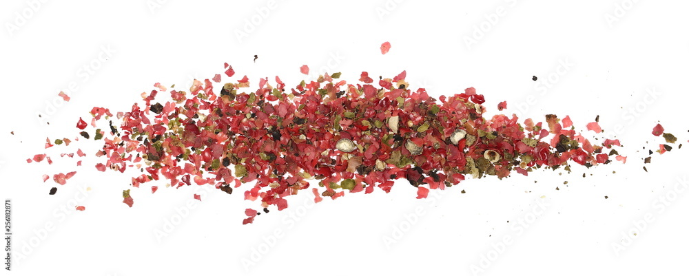 Obraz premium Colorful ground pepper grains isolated on white background, top view