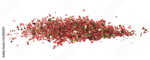 Colorful ground pepper grains isolated on white background, top view