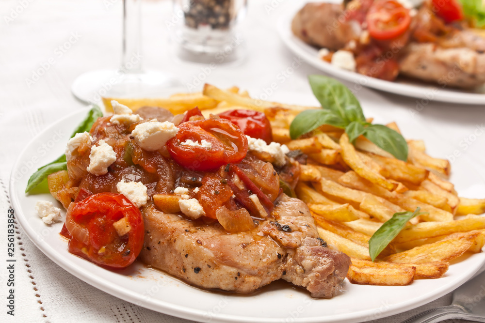two servings of pork chops two servings of pork chops