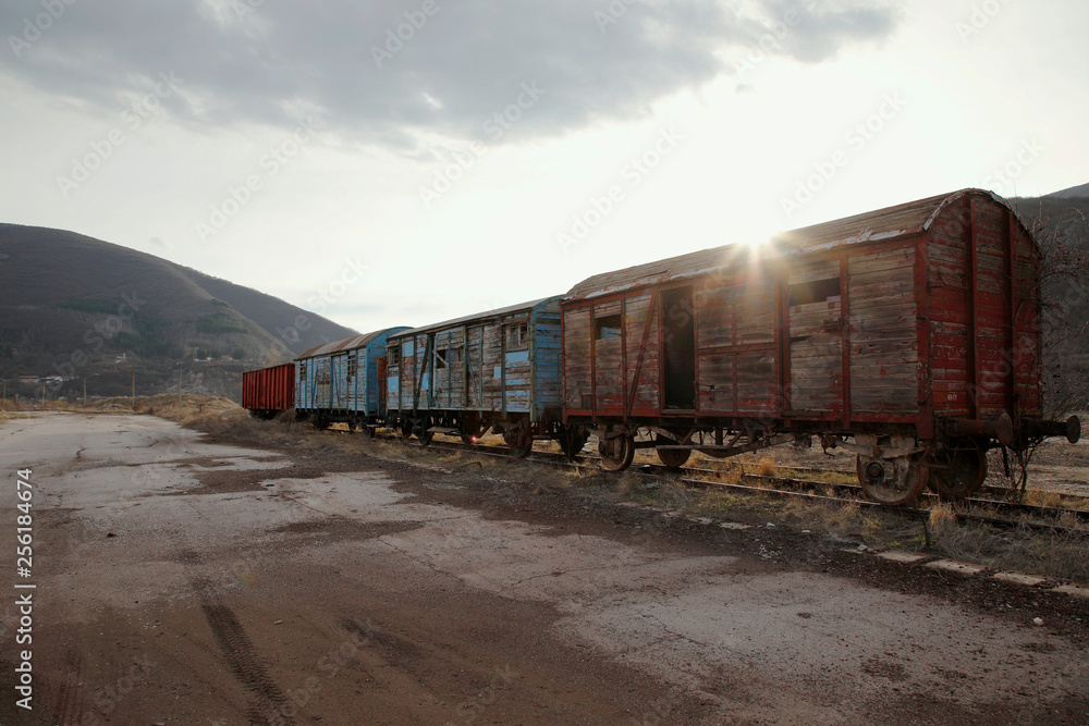 Old train wagons in an abandoned station Old train wagons in an abandoned station