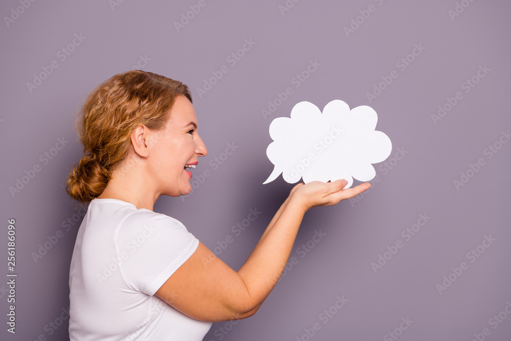 Profile side view portrait of nice attractive cheerful cheery wavy-haired lady in casual white t-shirt holding on palms cloud isolated on gray violet purple pastel background