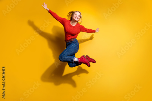 Full length body size view of her she nice attractive cool lovely cheerful cheery optimistic girl having fun free time isolated over bright vivid shine orange background
