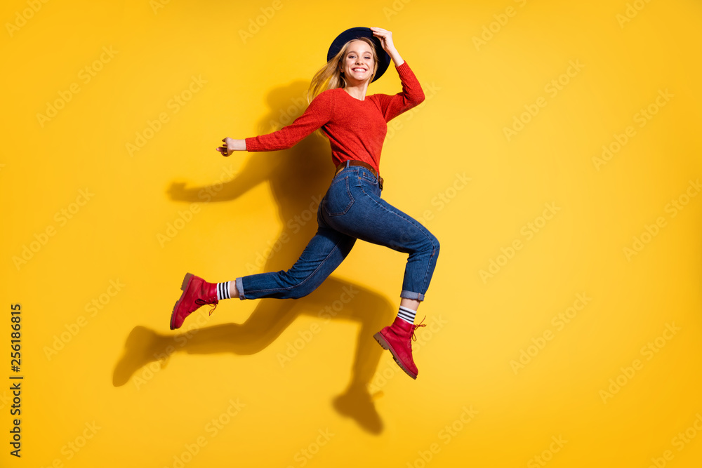 Profile side full length body size view of her she nice-looking attractive lovely fascinating fashionable cheerful careless carefree girl having fun isolated over bright vivid shine orange background
