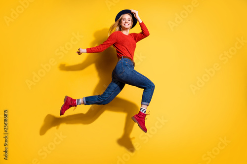 Fototapeta Naklejka Na Ścianę i Meble -  Profile side full length body size view of her she nice-looking attractive lovely fascinating fashionable cheerful careless carefree girl having fun isolated over bright vivid shine orange background