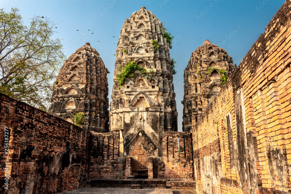 Ruins of the ancient temple of Wat Si Sawai in Sukhothai, Thailand