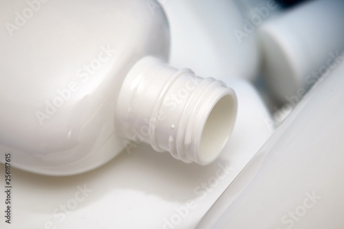 Empty white beauty cream plastic containers. Concept for recycling