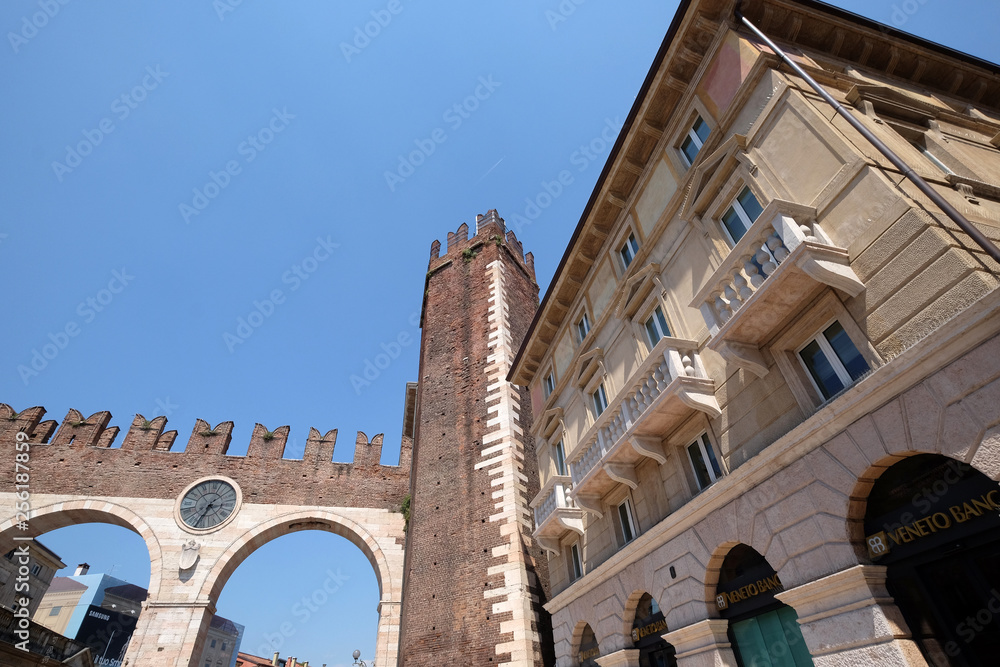Corso Porta Nuova street and medieval Gates Portoni della Bra on Piazza Bra in Verona, Italy