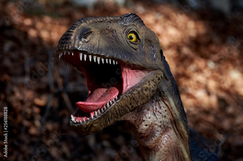 Portrait of dinosaur on nature background © DannyIacob