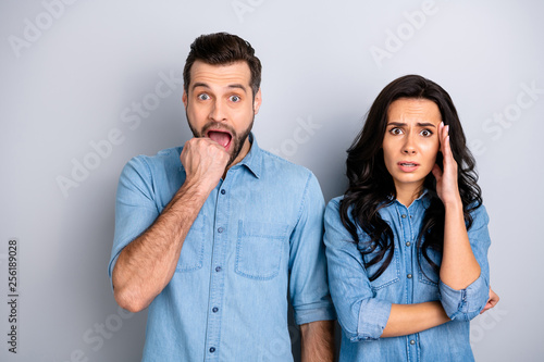 Close up portrait amazed two people she her he him his couple lady guy look oh no facial expression unbelievable unexpected news wear casual jeans denim shirts outfit clothes isolated grey background