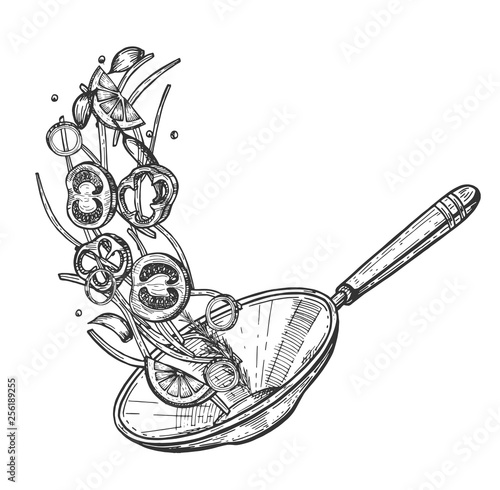 Chinese wok pan with flying ingredients