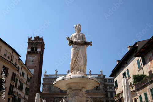 Fountain with roman statue called Madonna Verona built in 1368 by Cansignorio della Scala on Piazza delle Erbe Market`s square in Verona, Italy