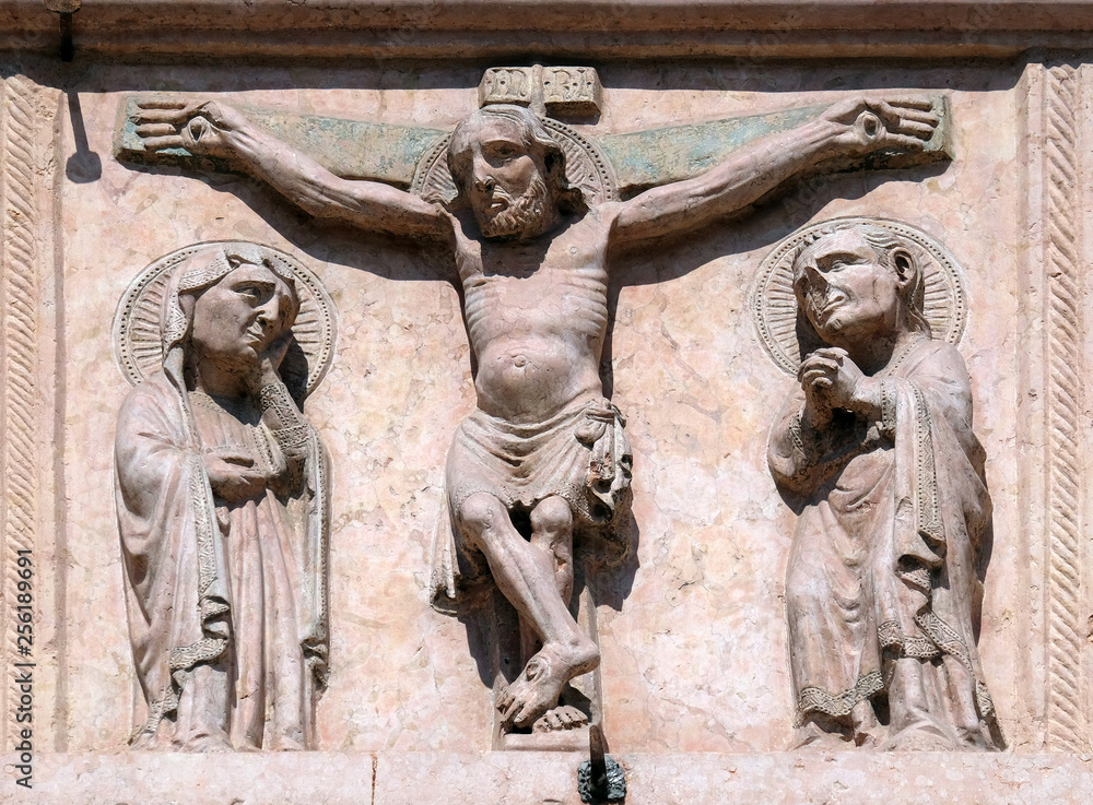Crucifixion, relief on Facade of Sant`Anastasia Church in Verona, Italy