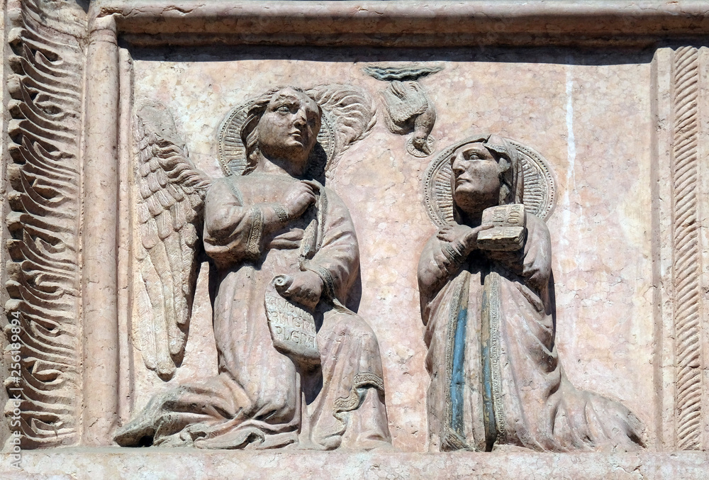 Annunciation of the Virgin Mary, relief on Facade of Sant`Anastasia Church in Verona, Italy