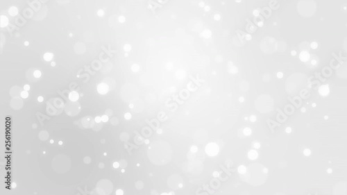 Glowing silver white bokeh background with floating light particles.