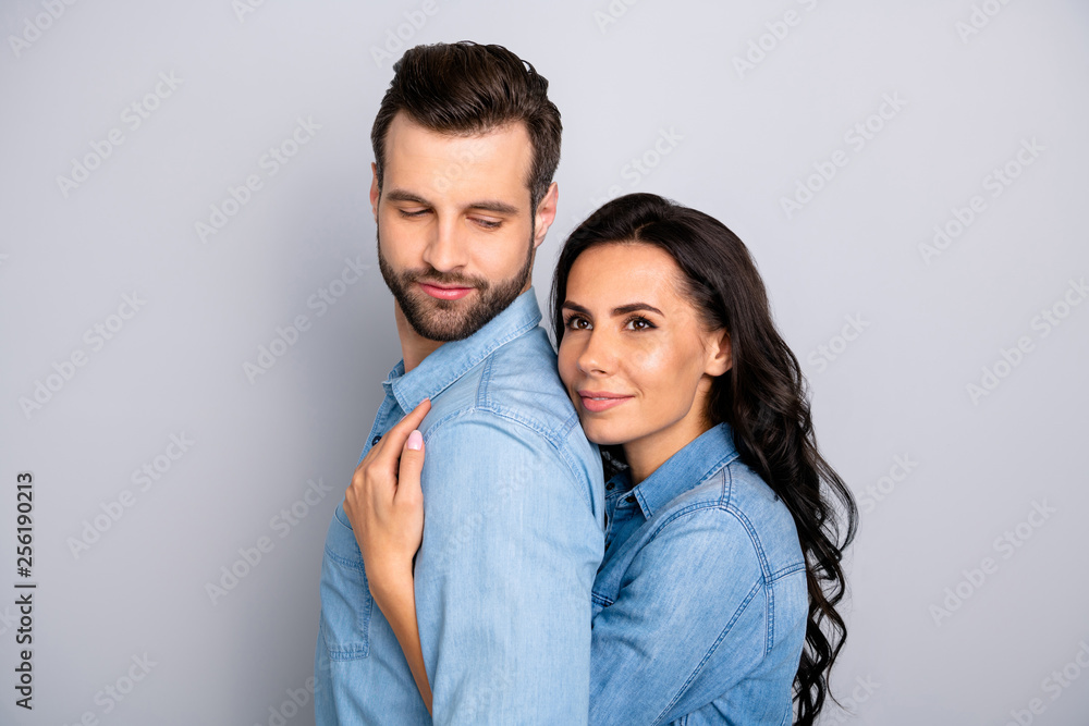 Fall in love. Close up photo of satisfied beautiful casual married students workers think dream future perfect family comfort affectionate cuddles blue denim clothing isolated argent background Fall in love. Close up photo of satisfied beautiful casual married students workers think dream future perfect family comfort affectionate cuddles blue denim clothing isolated argent background