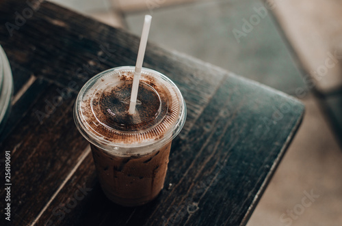 A glass of cold cocoa is located on a table in one cafe. 7