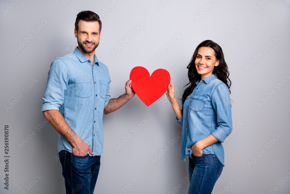 Portrait of cute beautiful spouses people enjoying trusting respecting holding huge valentine paper card satisfied positive wearing denim blue outfit isolated on ashy-gray background Portrait of cute beautiful spouses people enjoying trusting respecting holding huge valentine paper card satisfied positive wearing denim blue outfit isolated on ashy-gray background