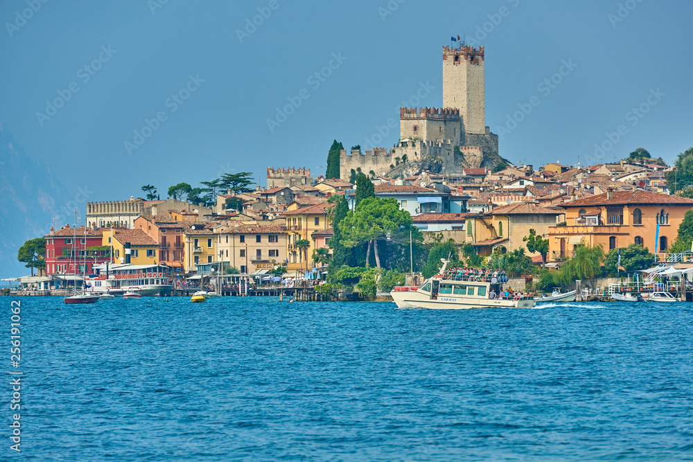 Malcesine,Lago di Garda ,Italy - 13 October 2018: View of the beautiful Lake Garda in Veneto region, Malcesine town and old castle on rock in the summer time, Italy