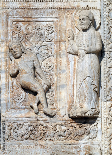 Creation of Adam, medieval relief on the facade of Basilica of San Zeno in Verona, Italy
